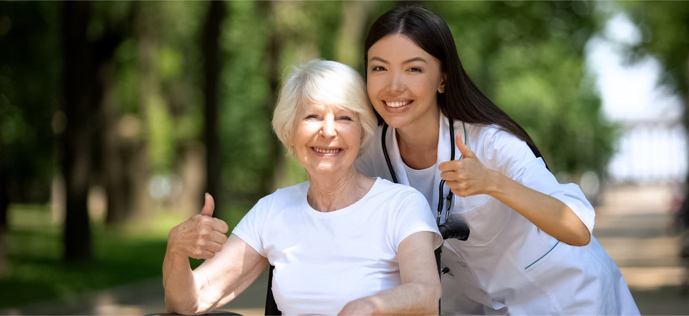 Nurse and Patient with Thumbs Up